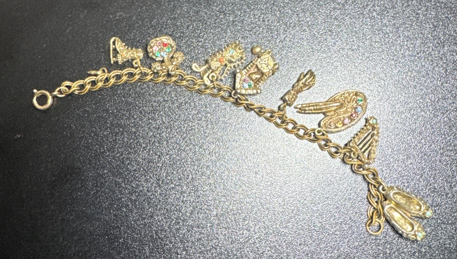 Vintage Monet Bracelet With 9 Charms Safety Chain 7.5″ 1970s 9095