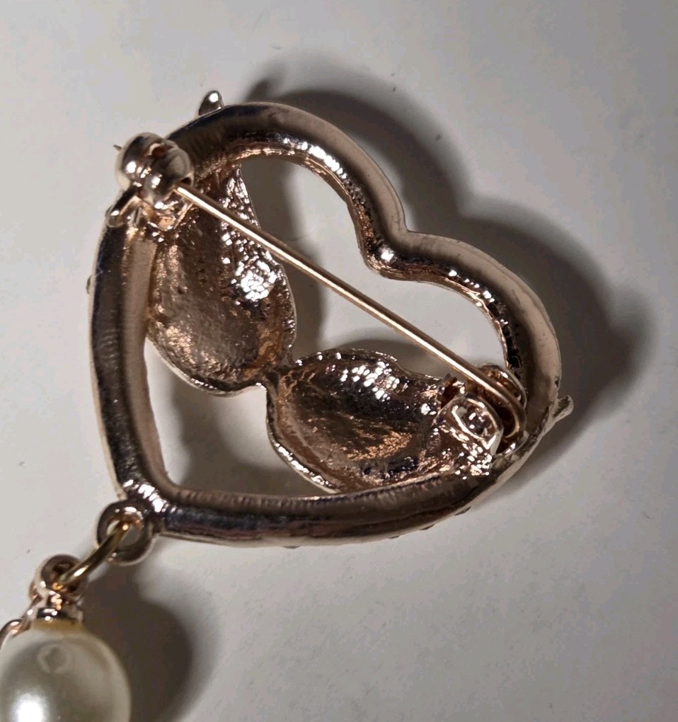 White Austrian Cyrstal Brooch In Rosetone With White Glass Pearl Wings Heart