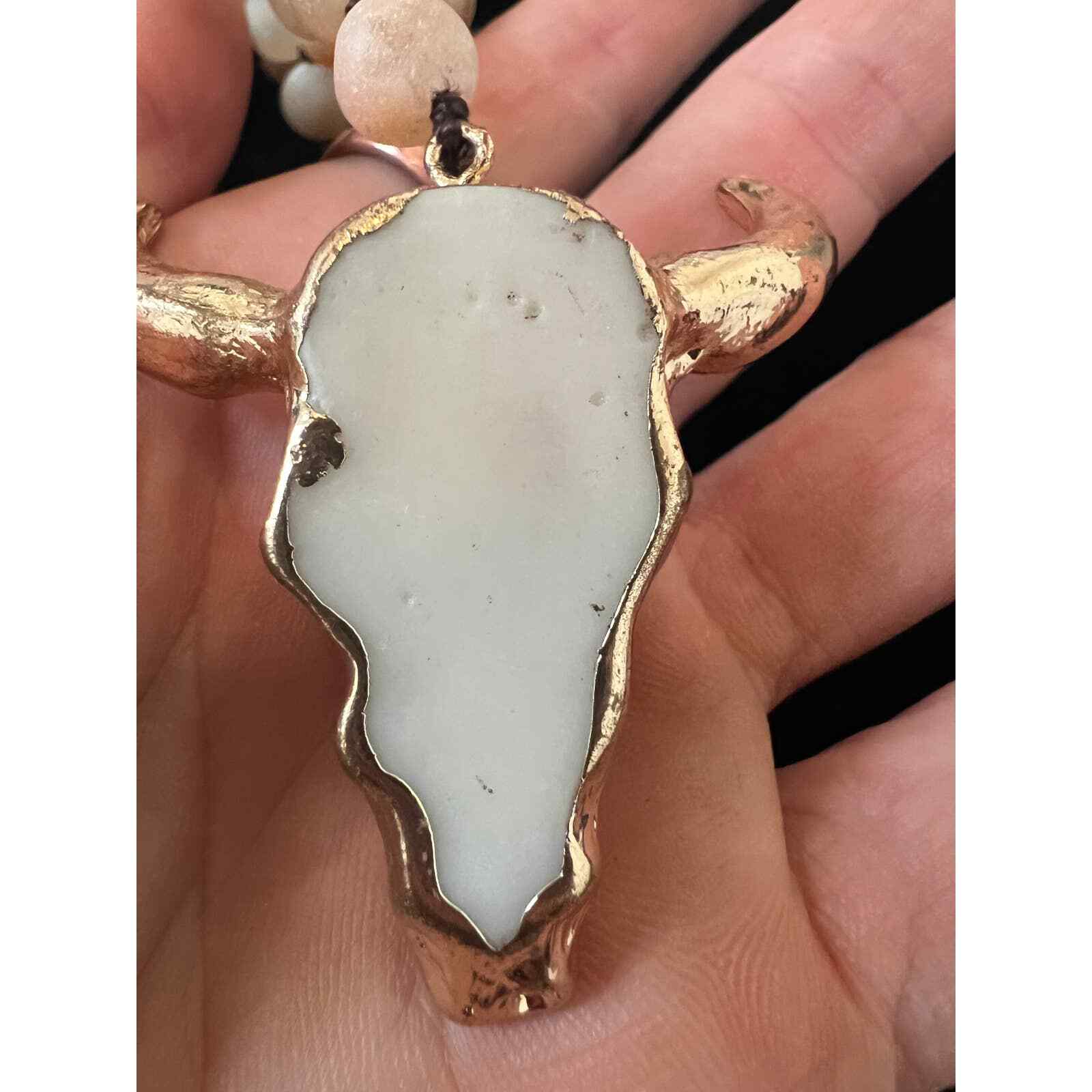Hand knotted Bull necklace. Beads are either glass or real stones I’m not sure.