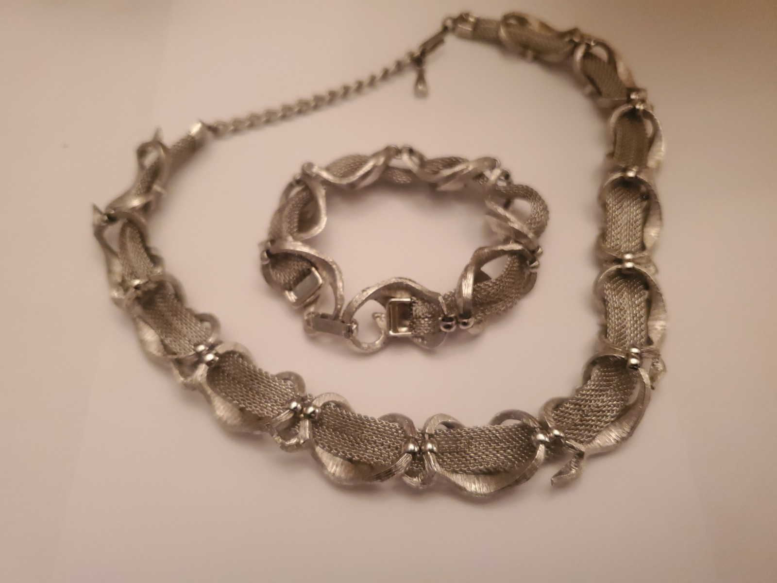 Vintage Coro Silvertone Set Features A Textured Ribbon Design And Includes Both