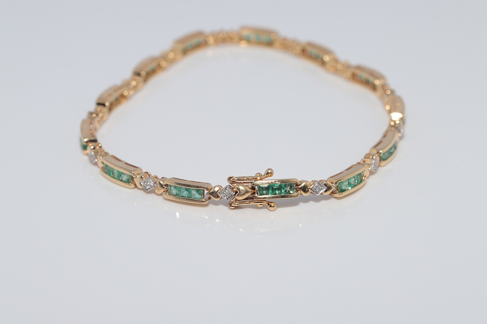 Vintage Circa 1980s 18k Gold Natural Diamond And Caliber Cut Emerald Bracelet