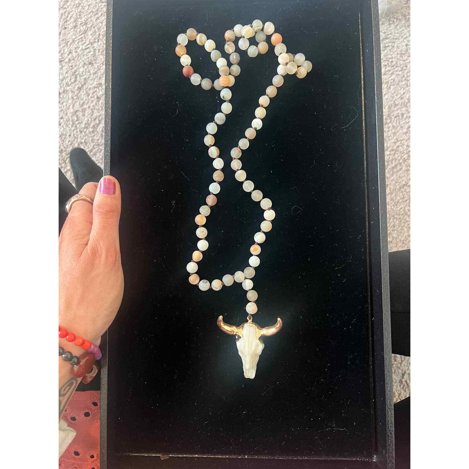 Hand knotted Bull necklace. Beads are either glass or real stones I’m not sure.