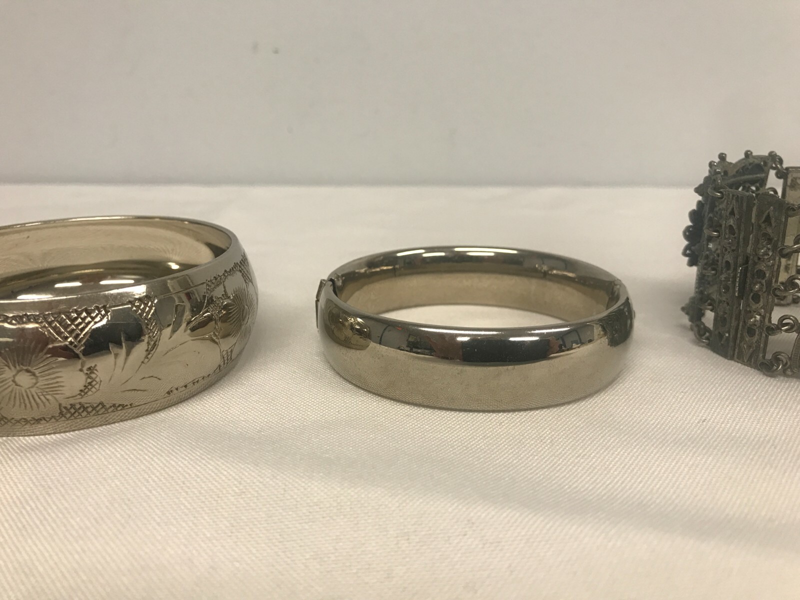 3 VINTAGE SILVERTONE HINGED BANGLE, PIERCED FILLIGREE & ETCHED FLOWER BRACELETS