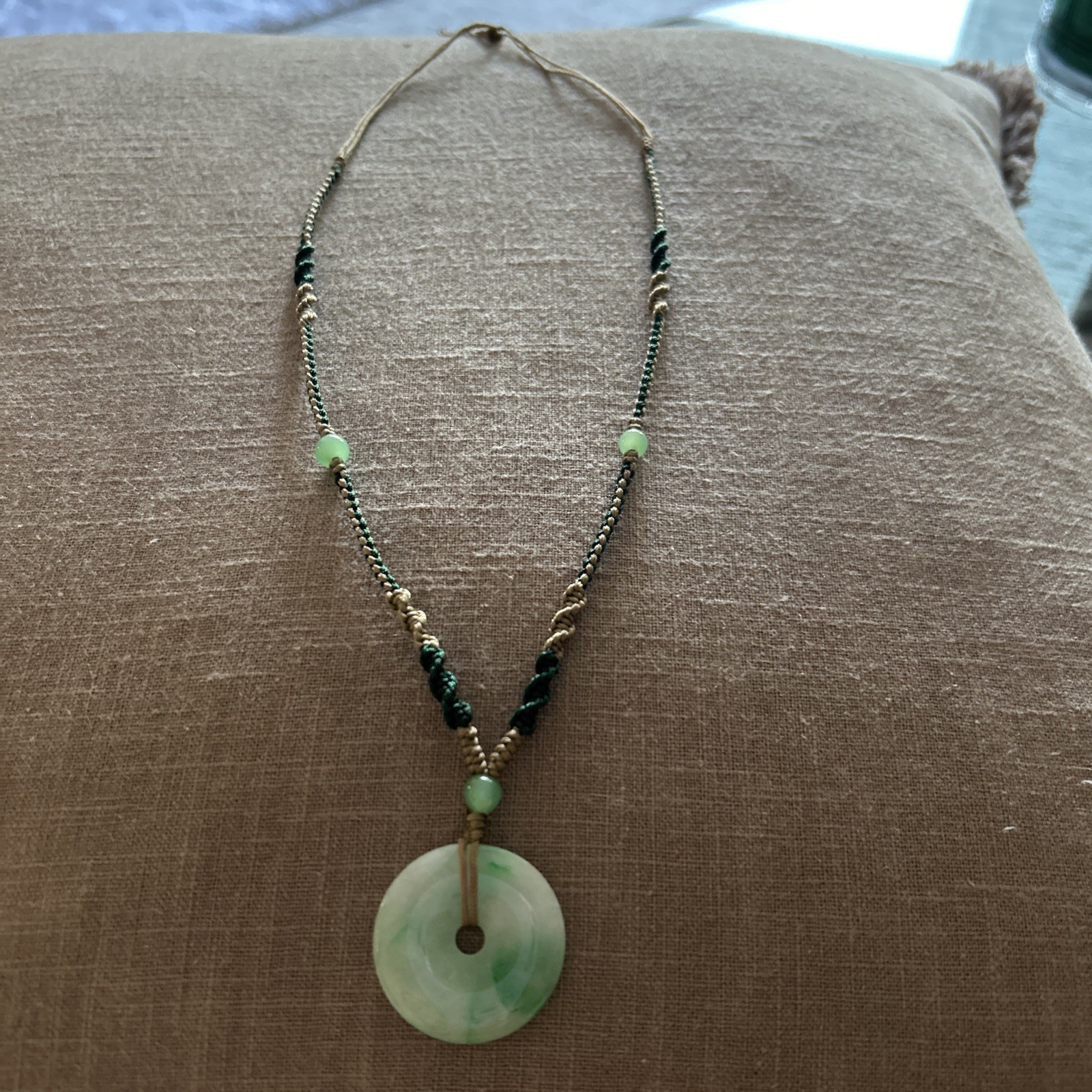 Vintage Green Jade Pendant 1-1/8” on a braided tan and green cord w/3 jade beads
