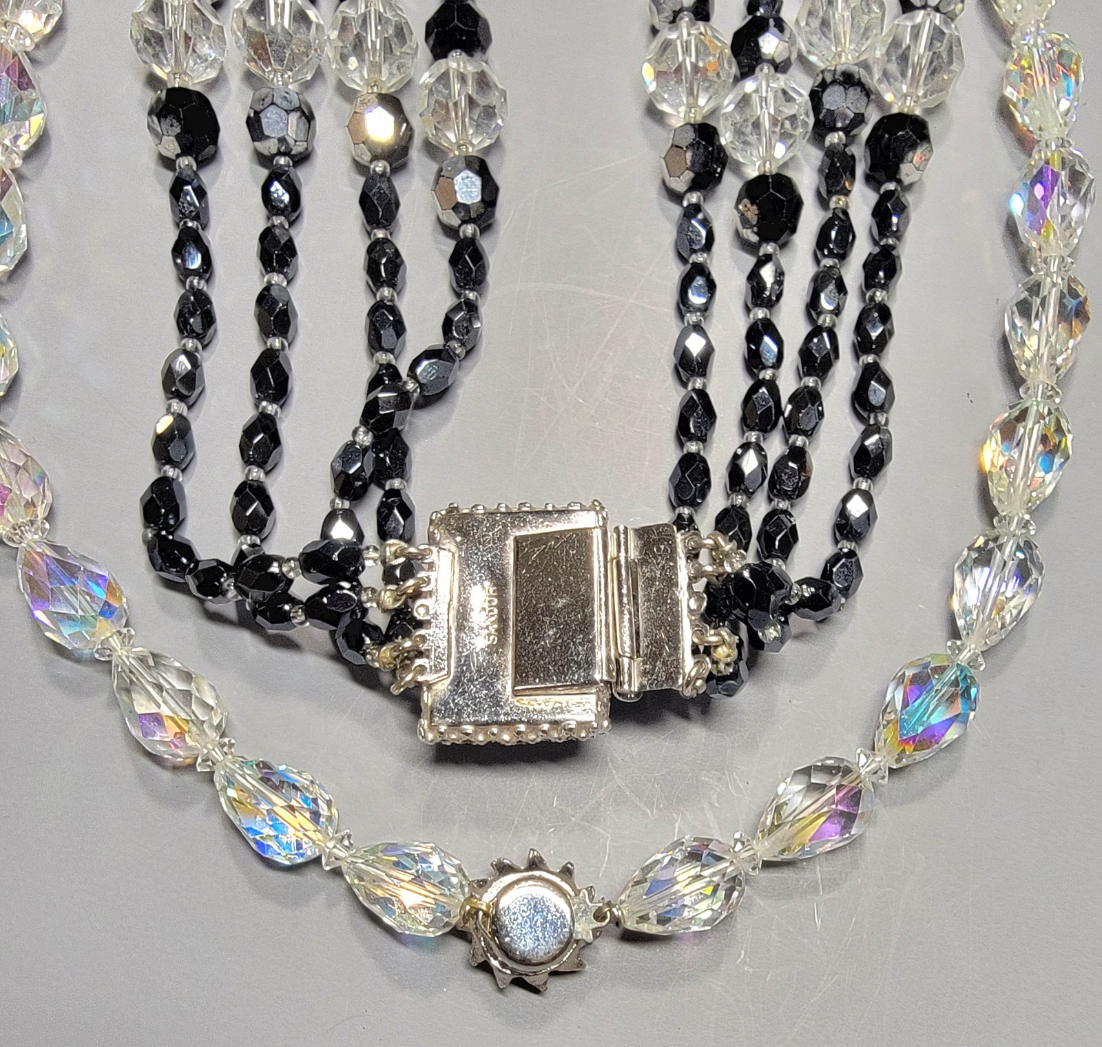 Sandor 4 Strand Black Crystal Signed Beaded And AB Clear Faceted Oval Necklaces