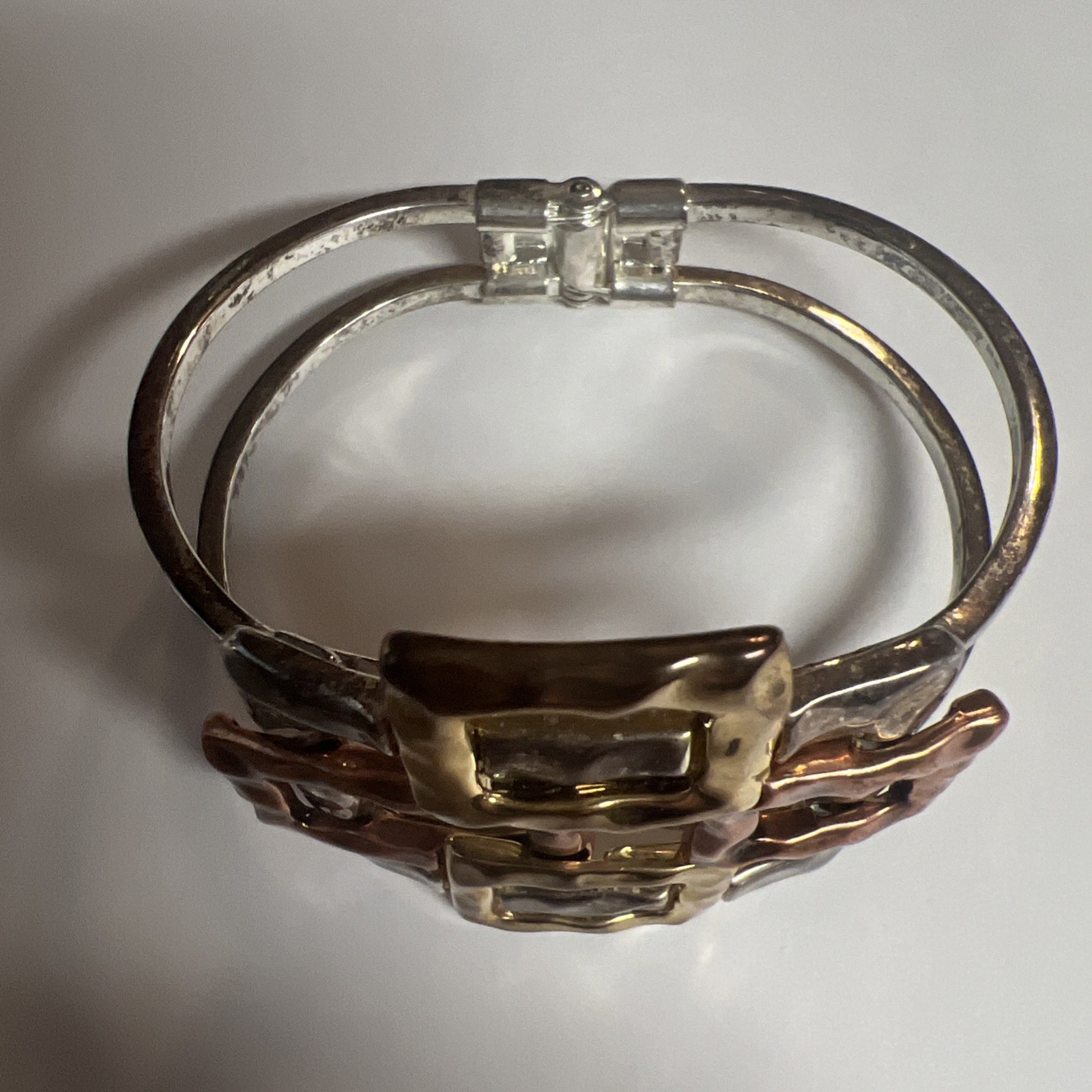 Brutalist mixed metal cuff bracelet, geometric silver and gold tone squares.