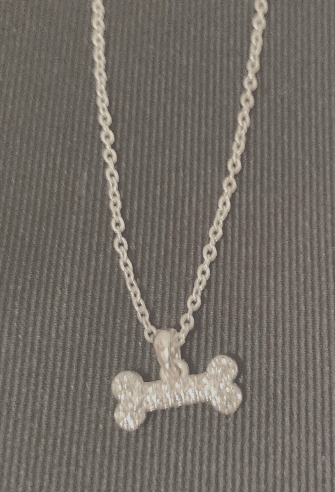 NAPIER Women’s Silver 16″-18″- 20″ Adjustable Necklace w/1/2″ Crystal Dog Bone