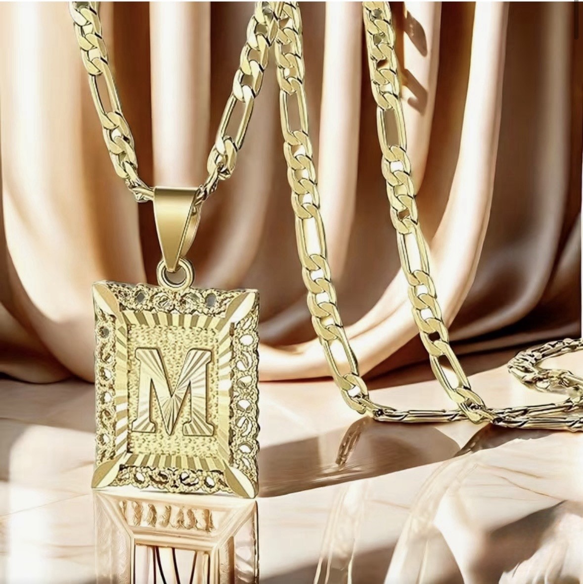 18 Gold Plated ‘M’ Pendant Necklace w/vintage-style sunburst & filigree detail.