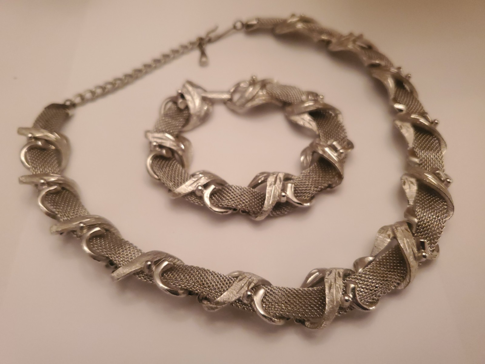 Vintage Coro Silvertone Set Features A Textured Ribbon Design And Includes Both