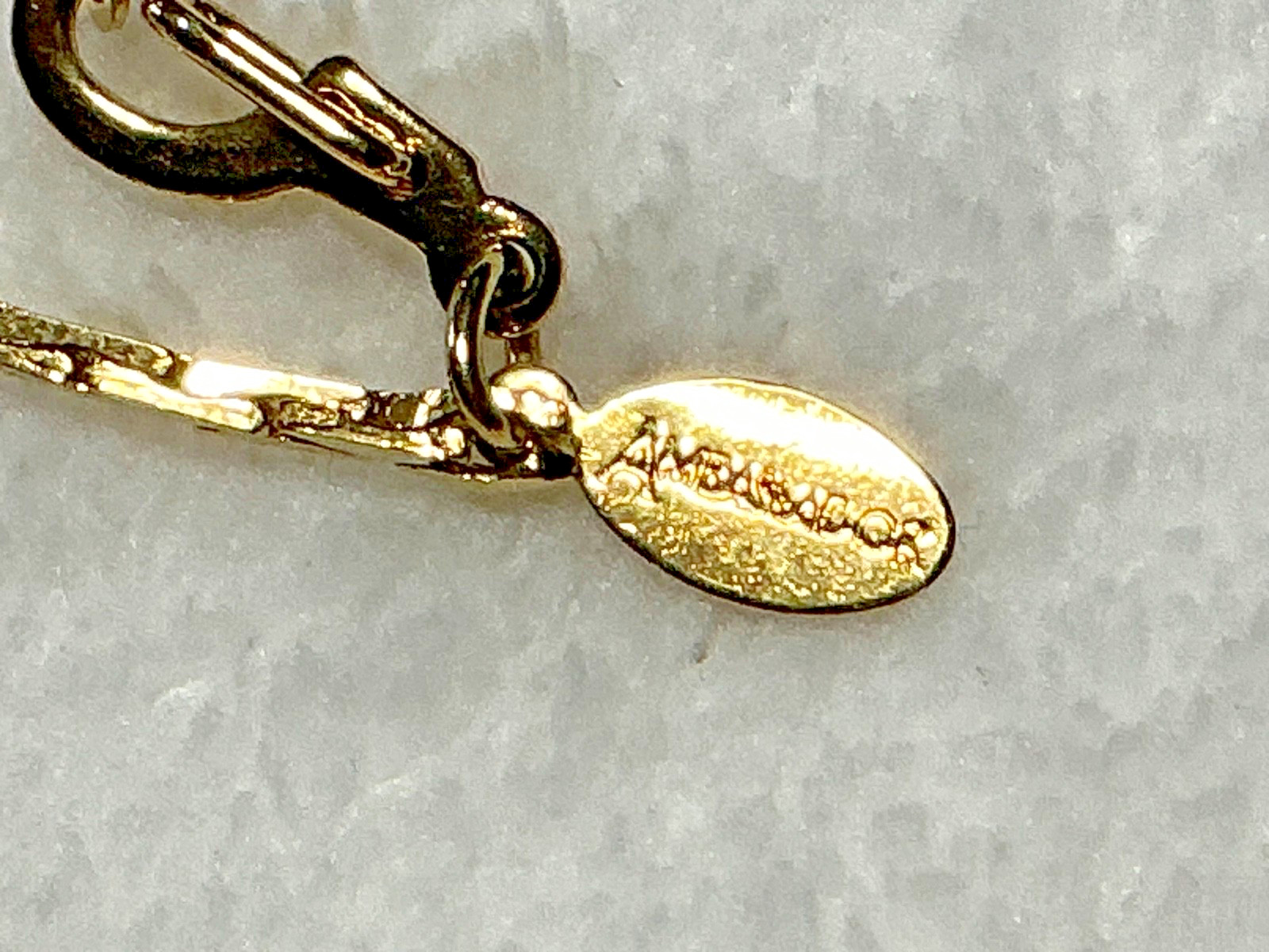 Vintage Brown Acrylic Disc Pendant with a brown rhinestone and Gold Tone Chain