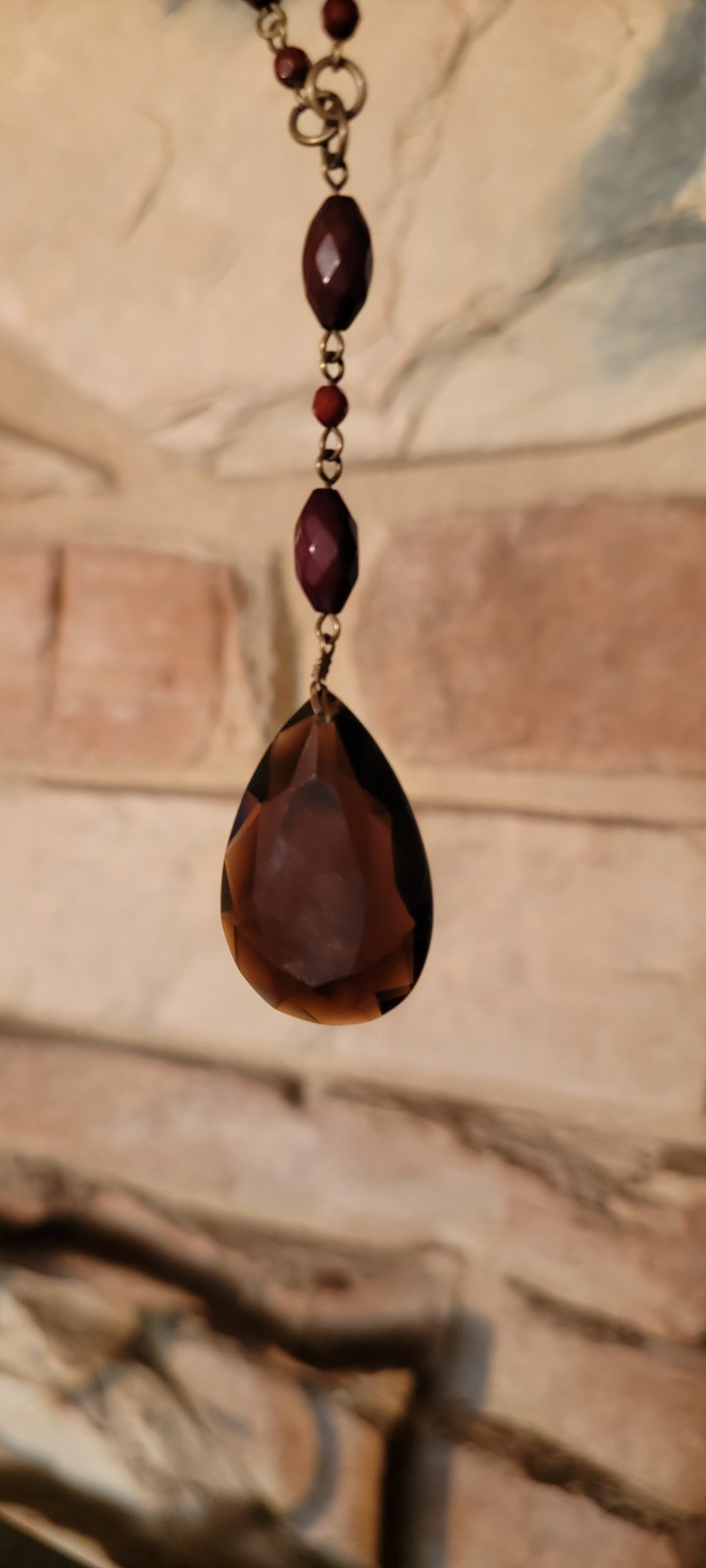 Faceted teardrop pendant necklace crafted with a distinctive vintage aesthetic
