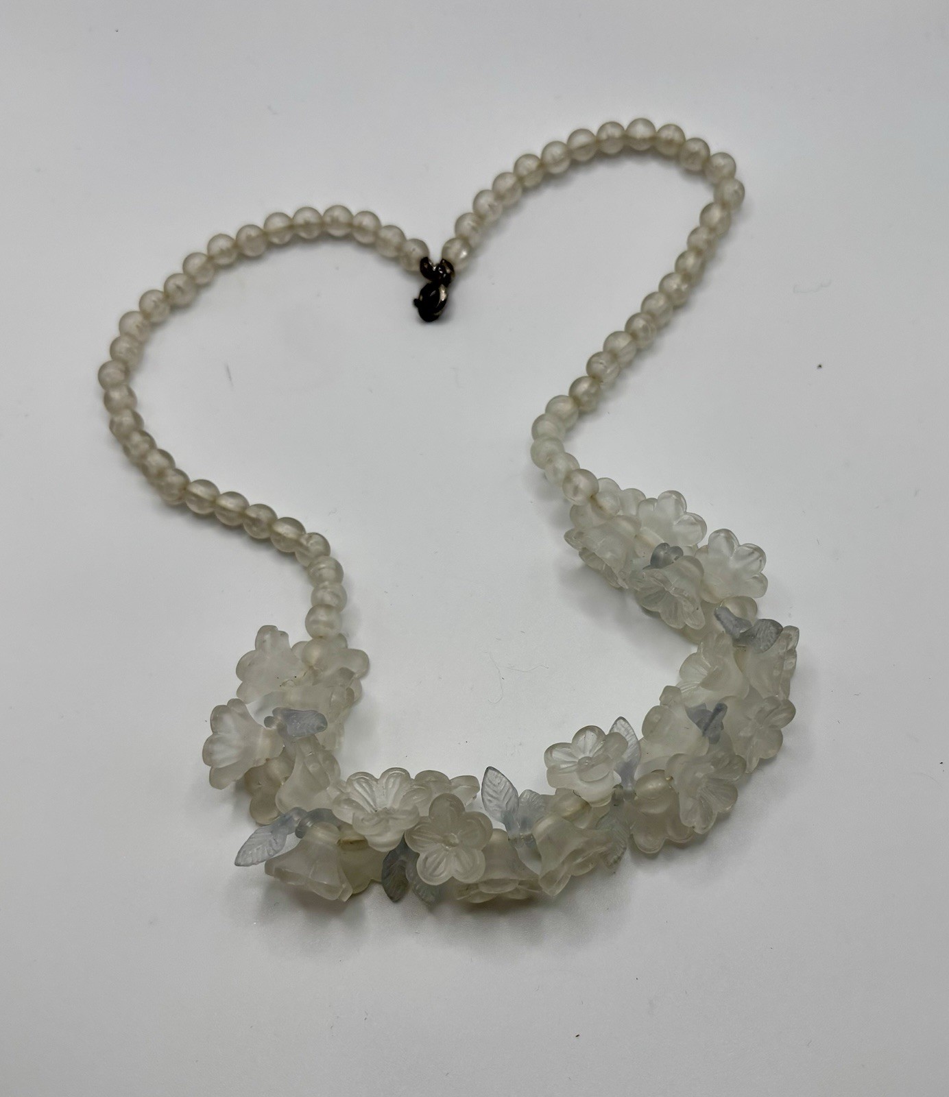 Vintage lucite floral cluster bib necklace molded flowers and leaves. 18”