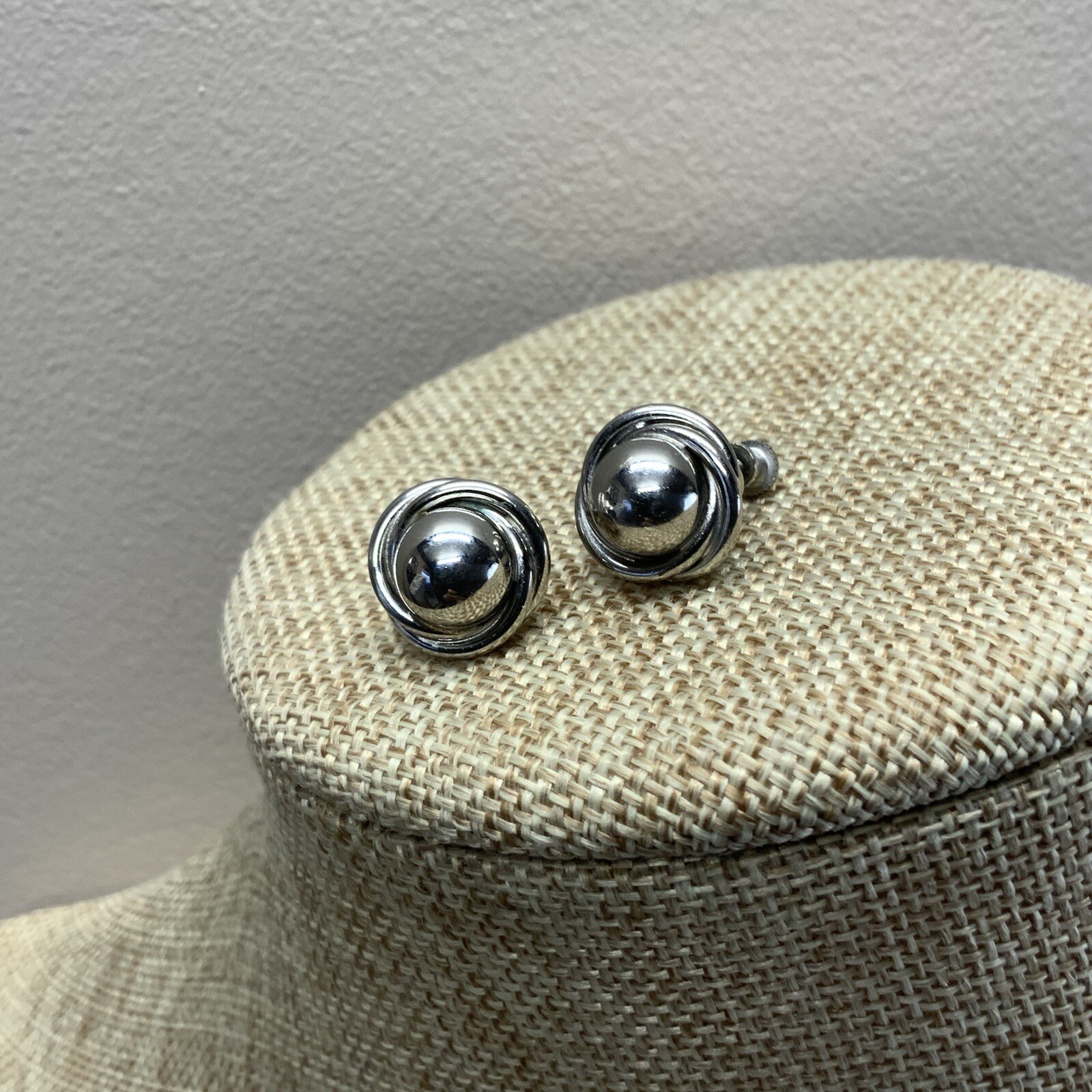 Vintage silver tone screw back knot earrings with dome