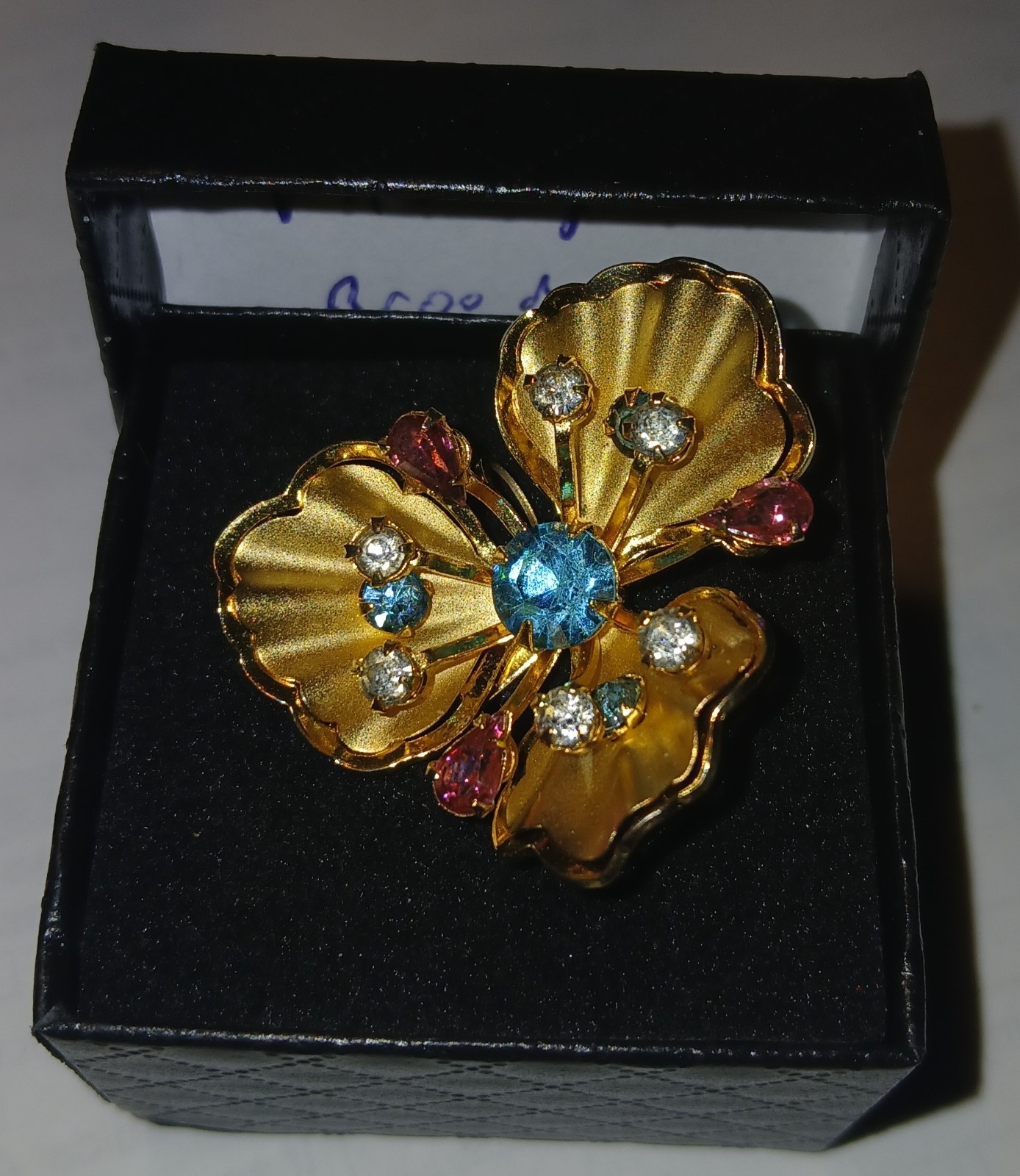 Vintage flower brooch/ pin with multi color rhinestones in gold metal setting