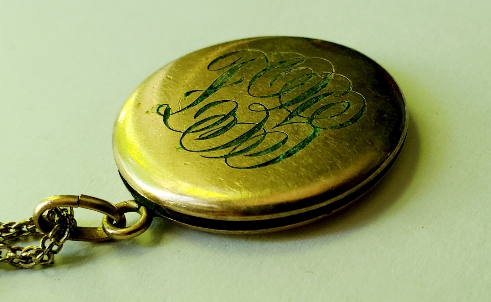 Antique gold tone etched/monogrammed locket pendant necklace stamped F.L.S.