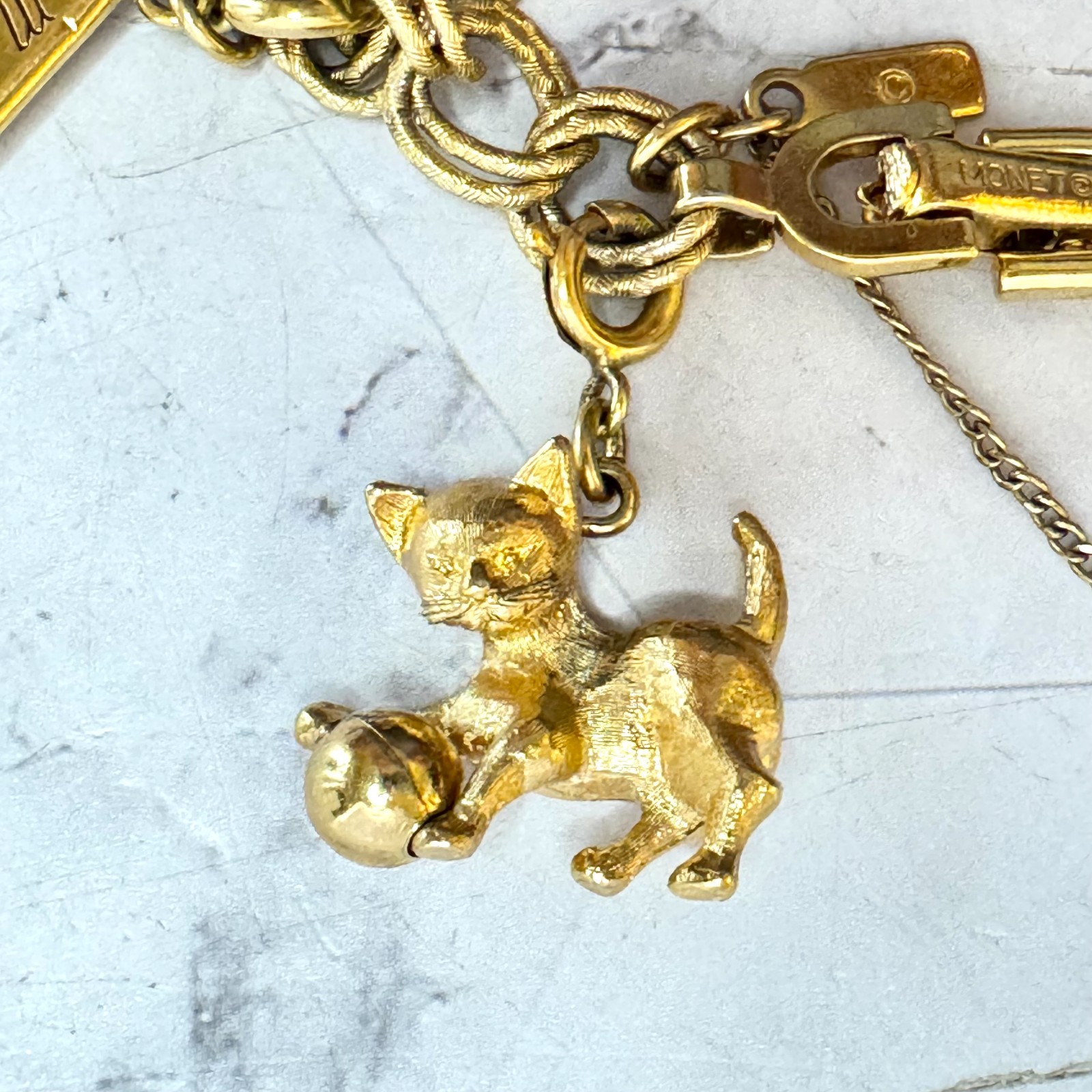 Vintage Monet Charm Bracelet Gold Tone Double Link 6 Charms Globe Kitten Cross