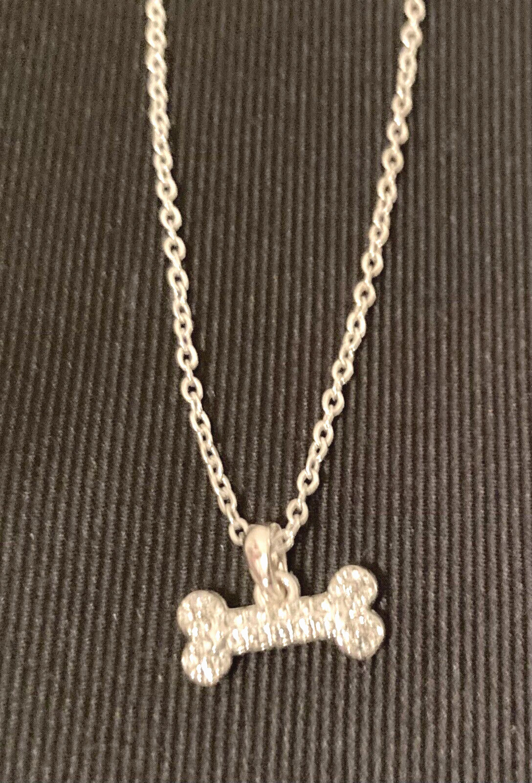NAPIER Women’s Silver 16″-18″- 20″ Adjustable Necklace w/1/2″ Crystal Dog Bone