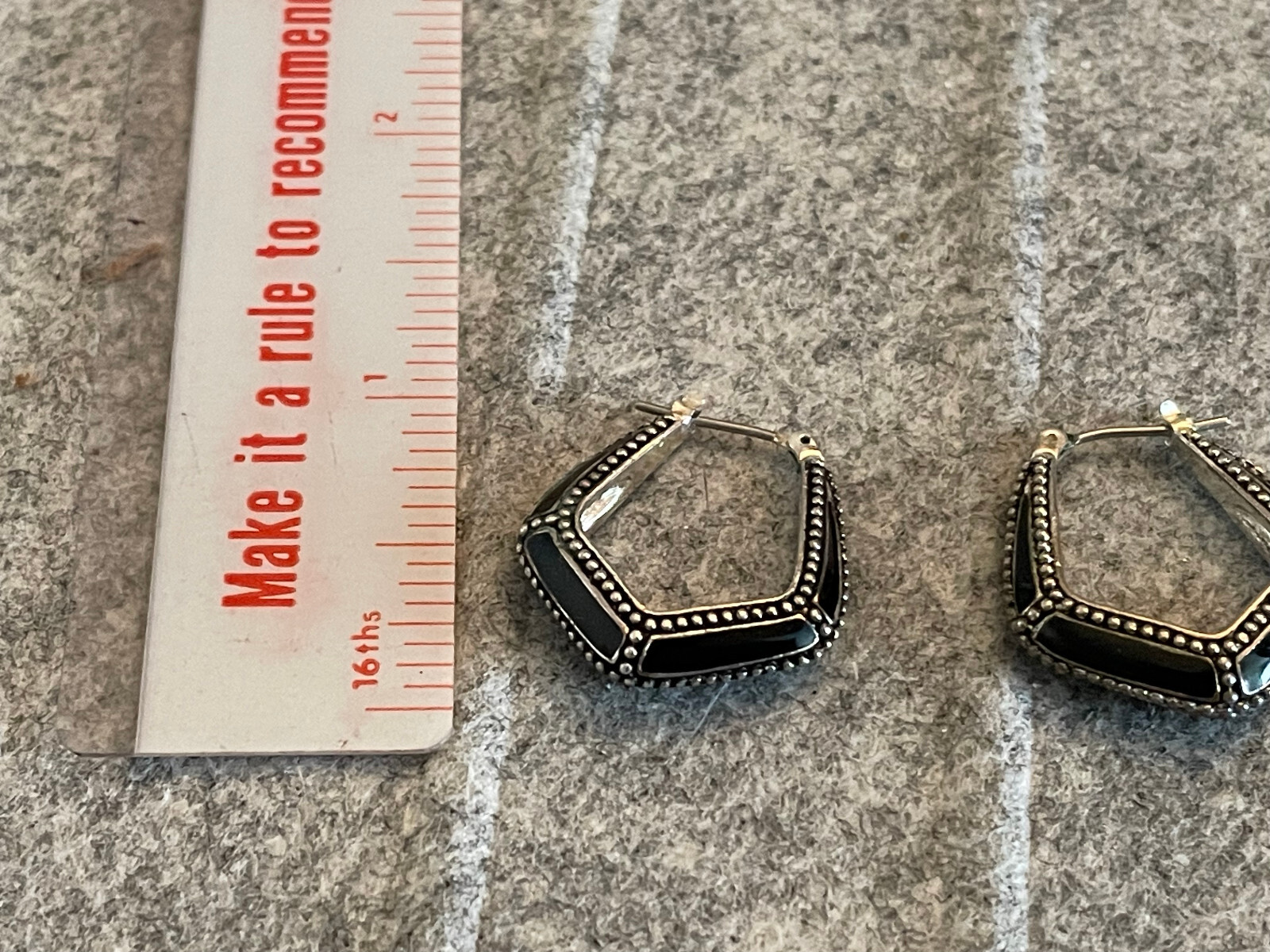 For auction is a Vintage MONET Silver Tone & Black Hoop Pierced Earring. Please