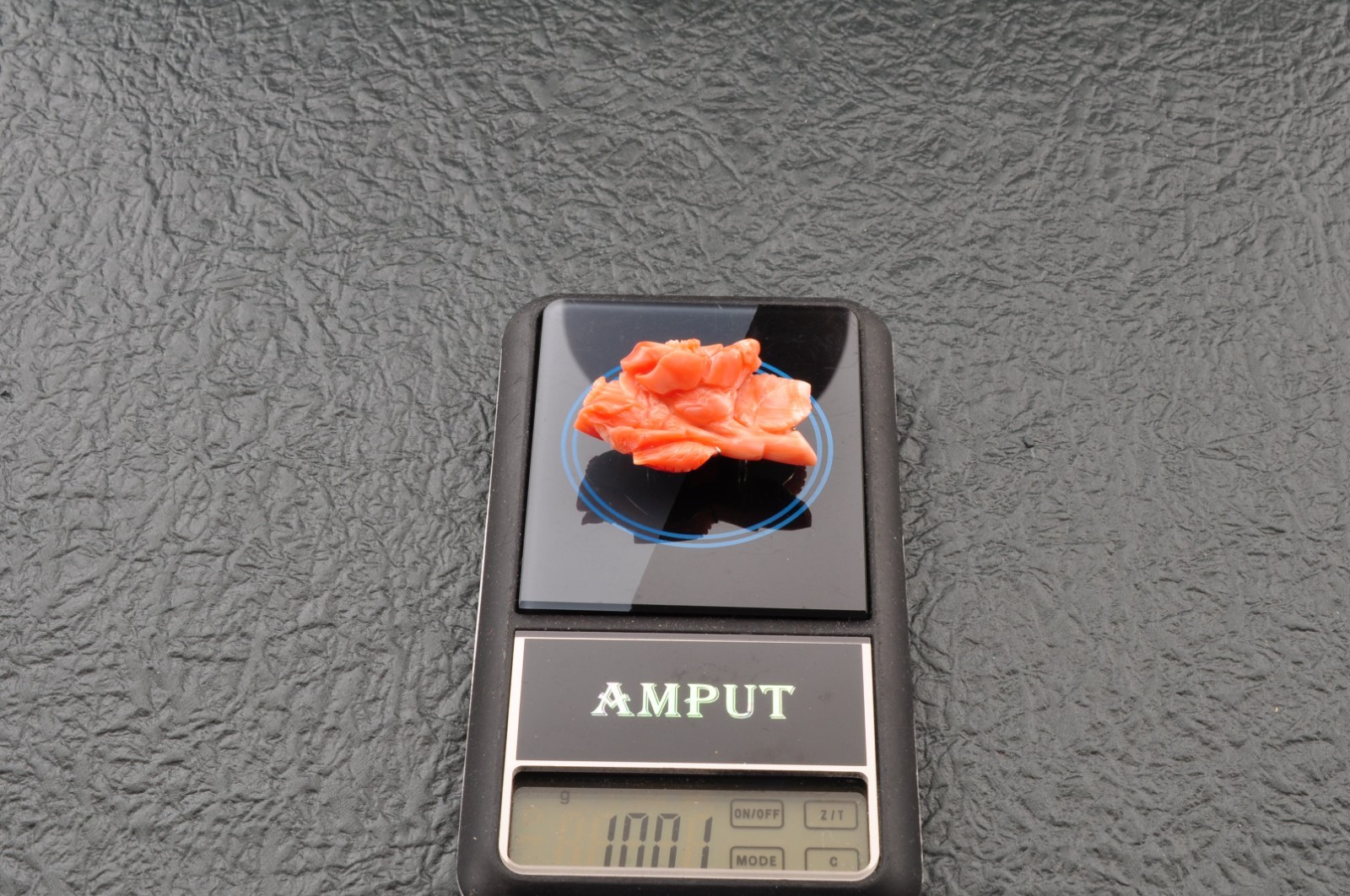 Pink coral OBIDOME, carved “camellia” (38mm (1.49in) total 50.0ct) Certificate.