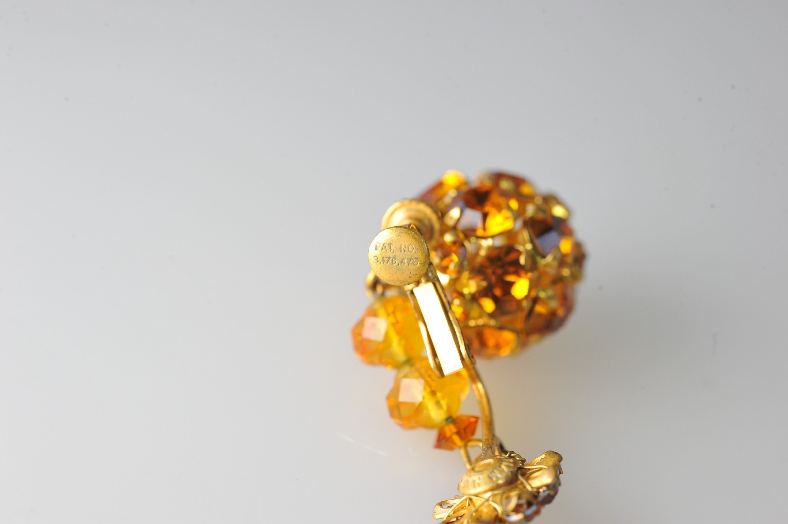 Vtg signed Miriam Haskell rhinestone Gold Tone drop clip earrings amber color