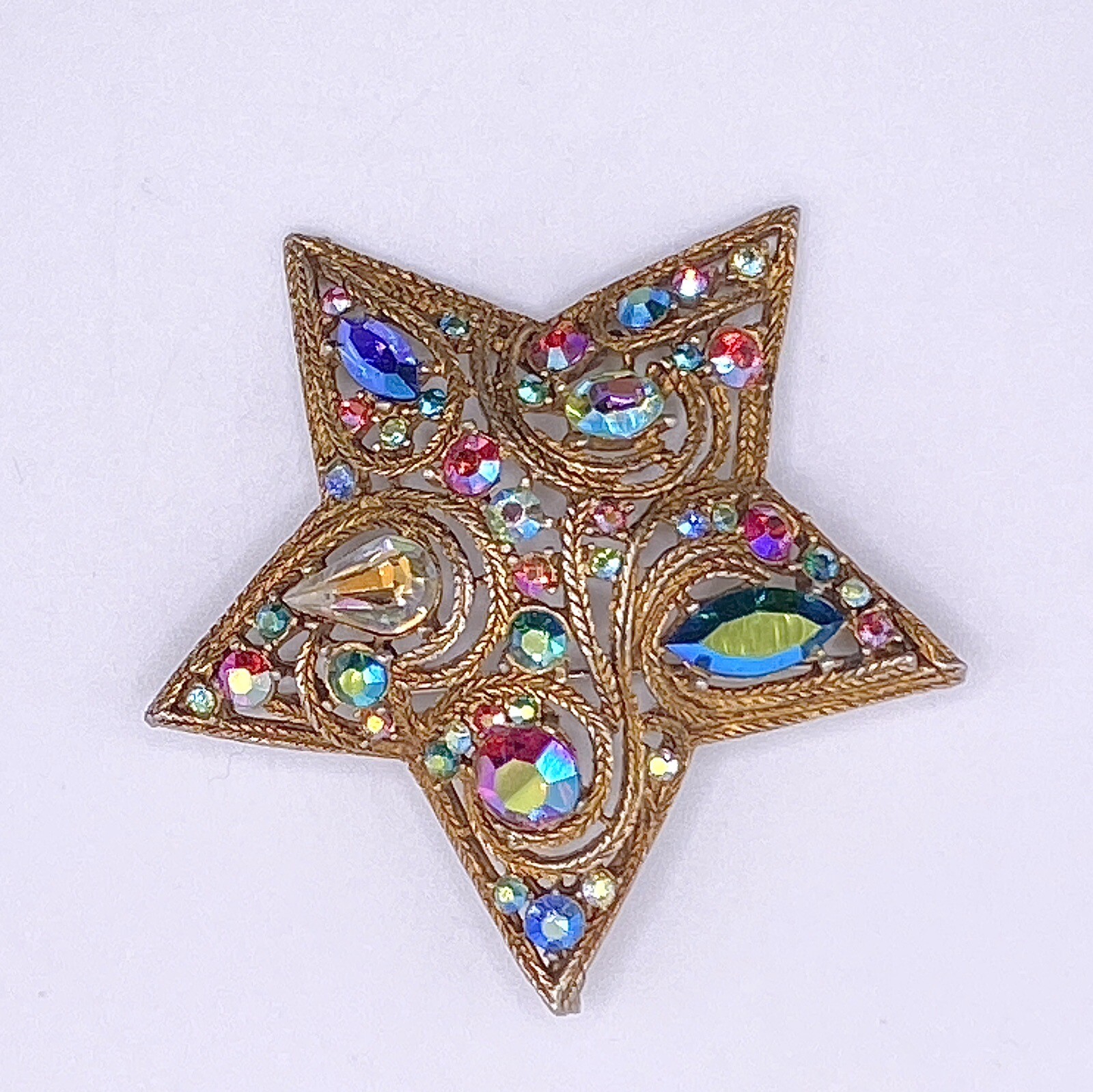 La Roco 1950s Star Brooch Colorful Gold Tone Rhinestones Textured Gold Plate