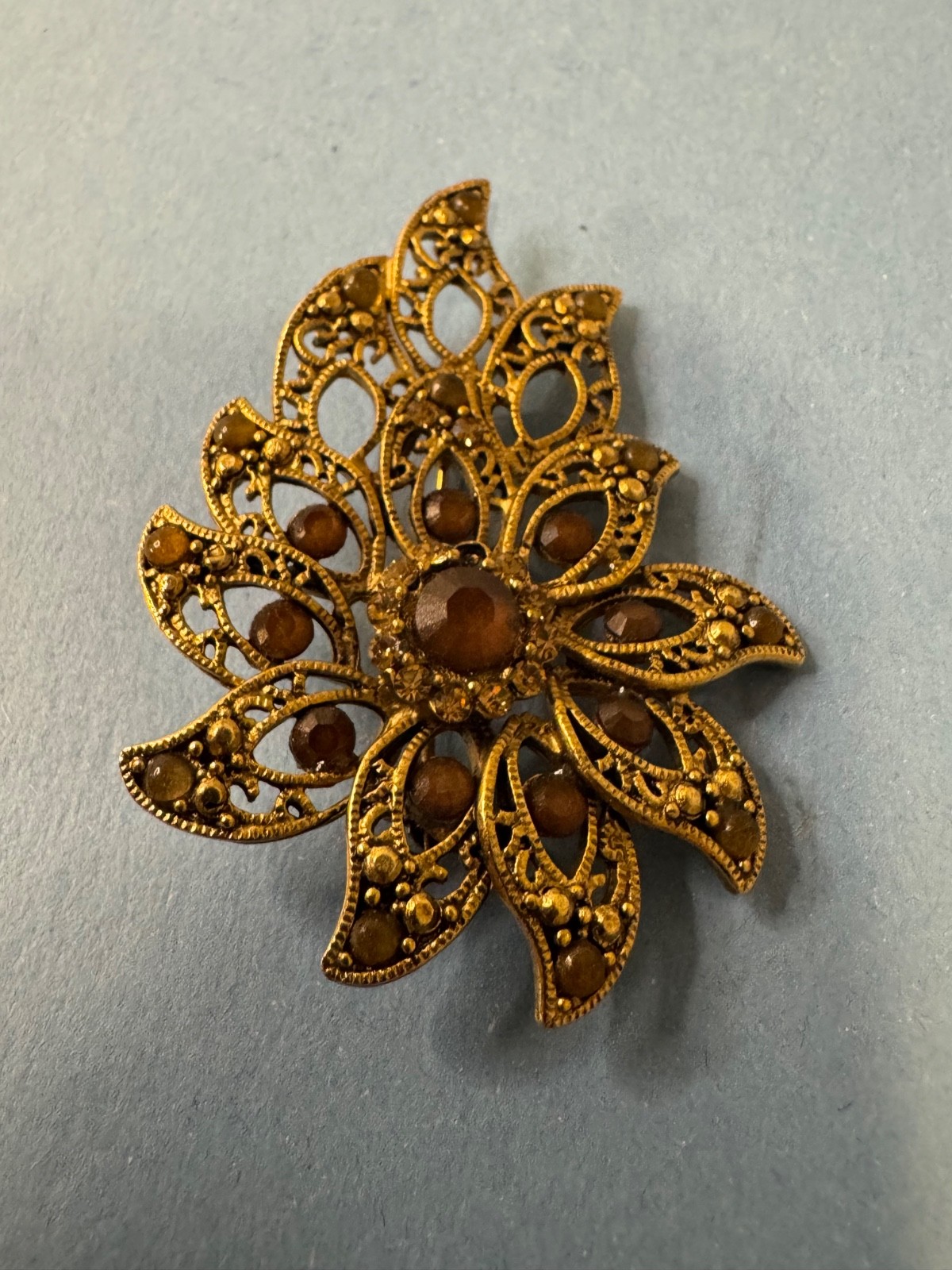 Gold Tone Brooch with Amber and Brown Glass Stones In A Floral or Leaf Design