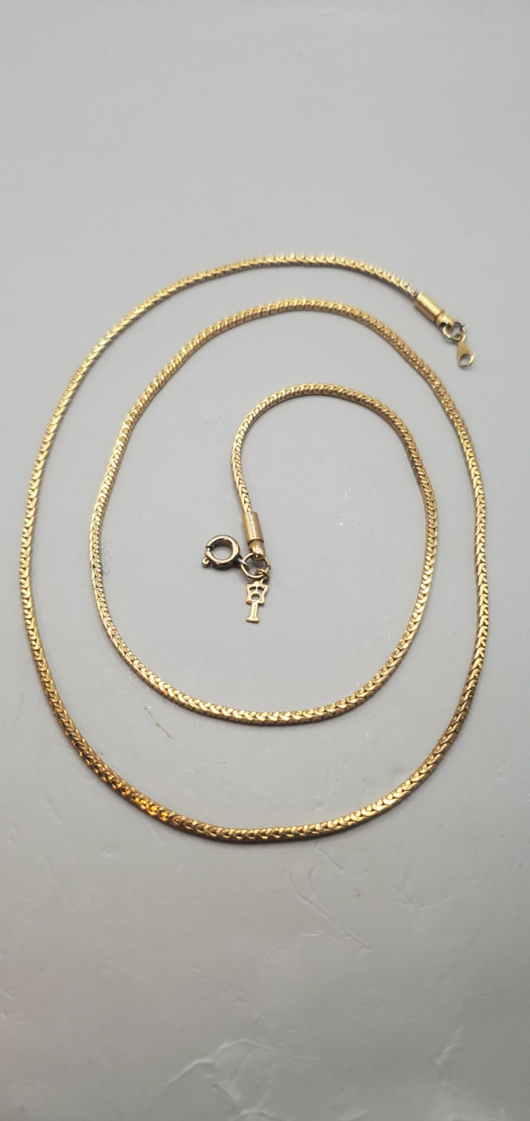 3 Vtg Chains: Trifari 24″, Herringbone 20″, Gold Tone & Black Twisted Rope 30″