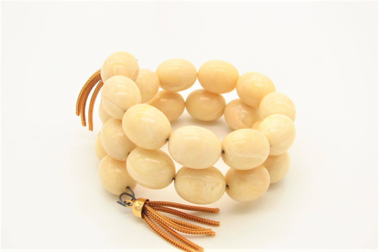 Vtg Coil Bracelet w/Faux Ivory Galalith Beads and Gold Tone Tassel Ends