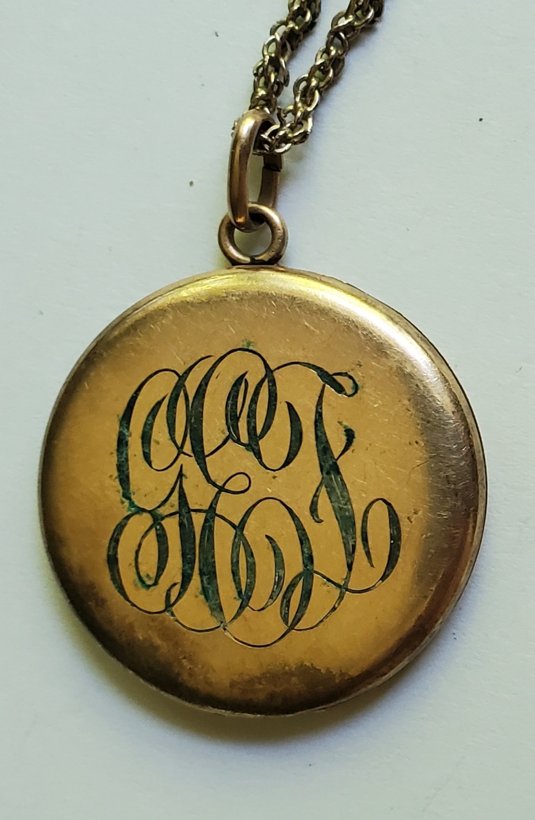 Antique gold tone etched/monogrammed locket pendant necklace stamped F.L.S.