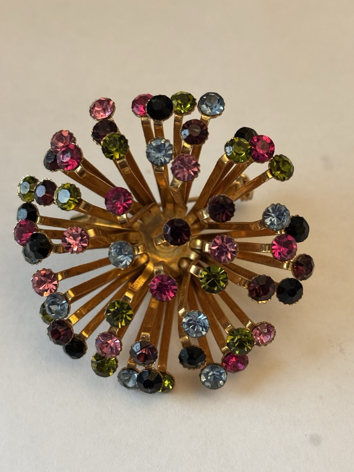 Blue And Pink/ Purple crystals in Gold metal setting round brooch/pin