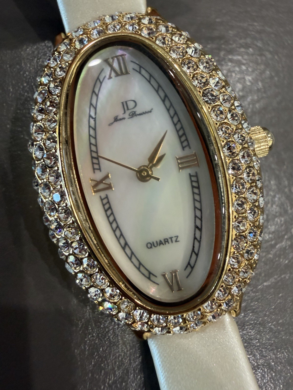 Vintage Jean Dousset Leather, Rhinestone Watch With Beige oval face.