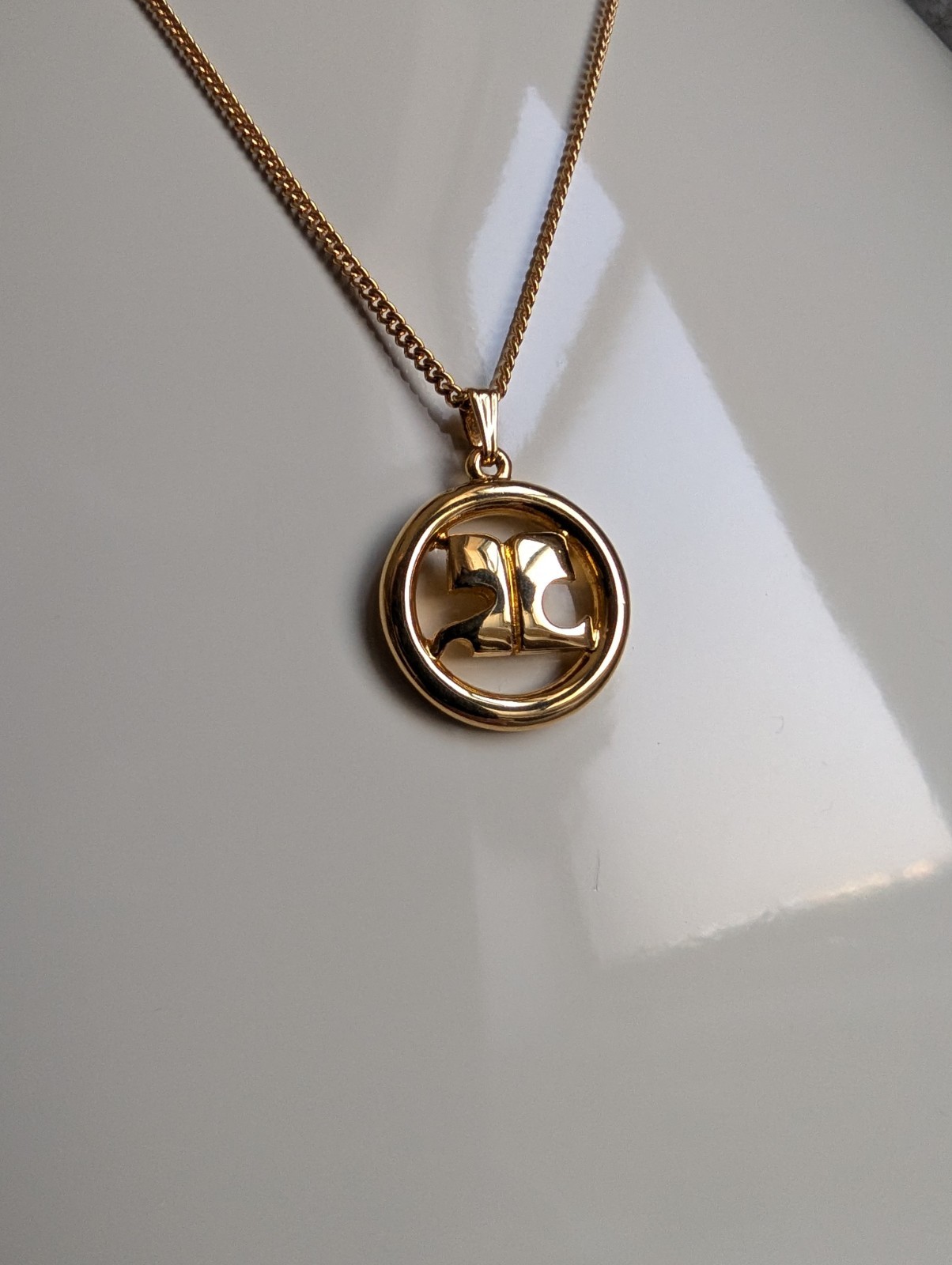 Vintage Courrèges Gold-Plated Circular “AC” Logo Pendant Necklace