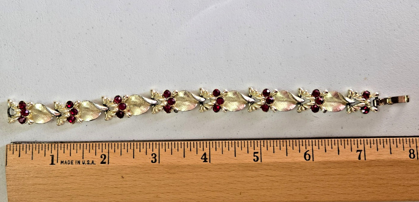 Vintage STAR Bracelet. Signed. Goldtone Setting with Red Rhinestone Accents.