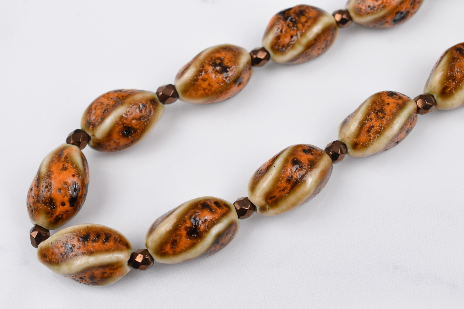 Gold Plated 21″ Cream Brown Orange Twist Ceramic Necklace w/ Bronze Spacers