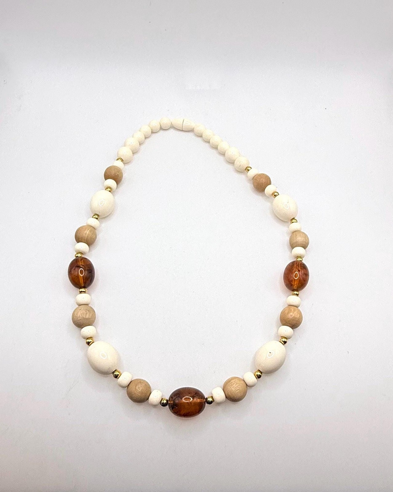 Vintage off white light wood and brown marbled amber colored beaded necklace