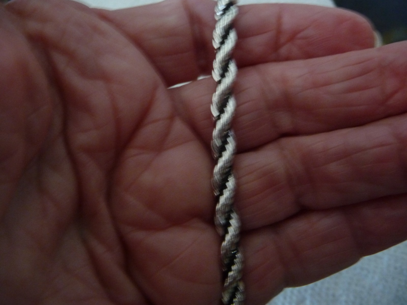 TWISTED SILVER TONE CHAIN W BLACK WRAPPED CORD 7” L 1/4” W BRADCELET #28/5