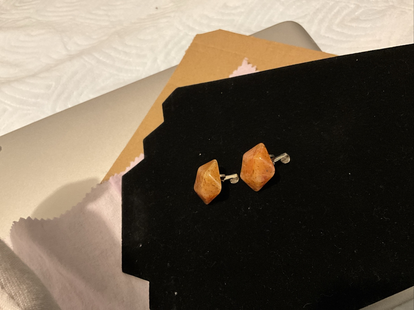 Bakelite Carved Apple Juice Clip On Earings About I 1/4 Inch Across 3/8 Thick.