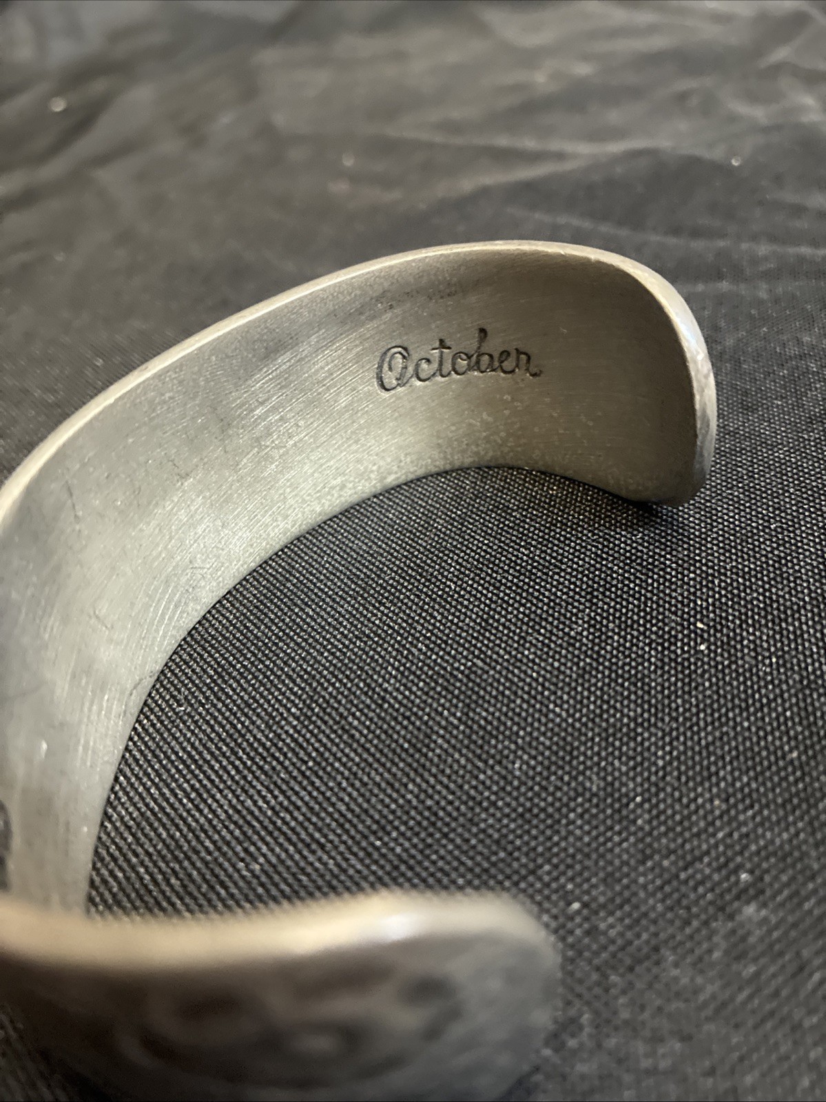 Vintage cuff bracelet marked Salisbury Pewter Engraved With ‘October’