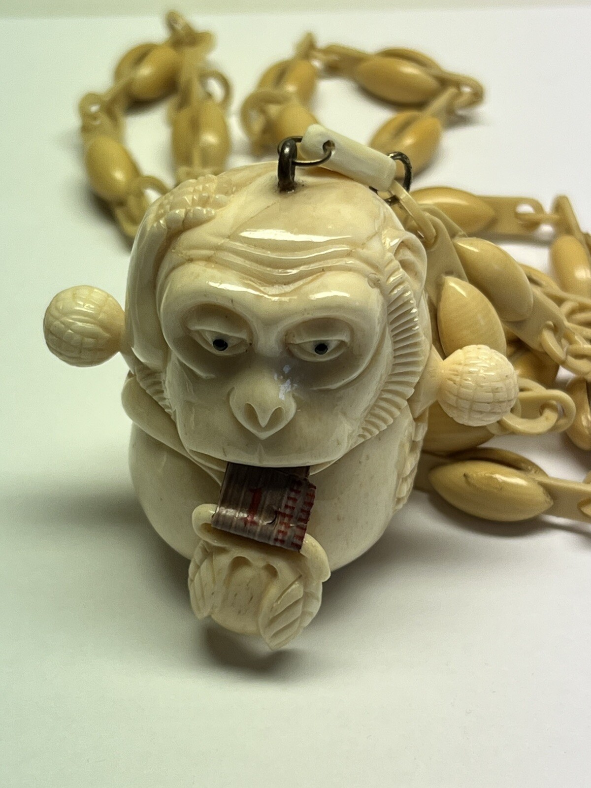 ANTIQUE ART DECO MONKEY NECKLACE TAPE MEASURE CELLULOID CHAIN PENDANT WHIMSICAL