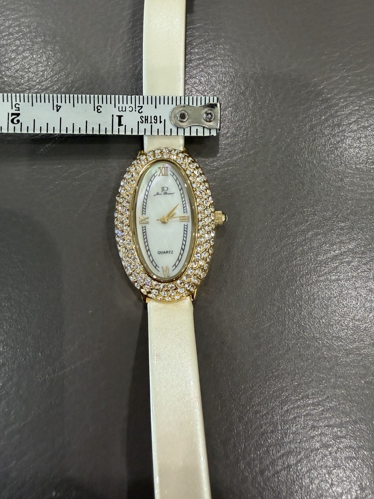 Vintage Jean Dousset Leather, Rhinestone Watch With Beige oval face.