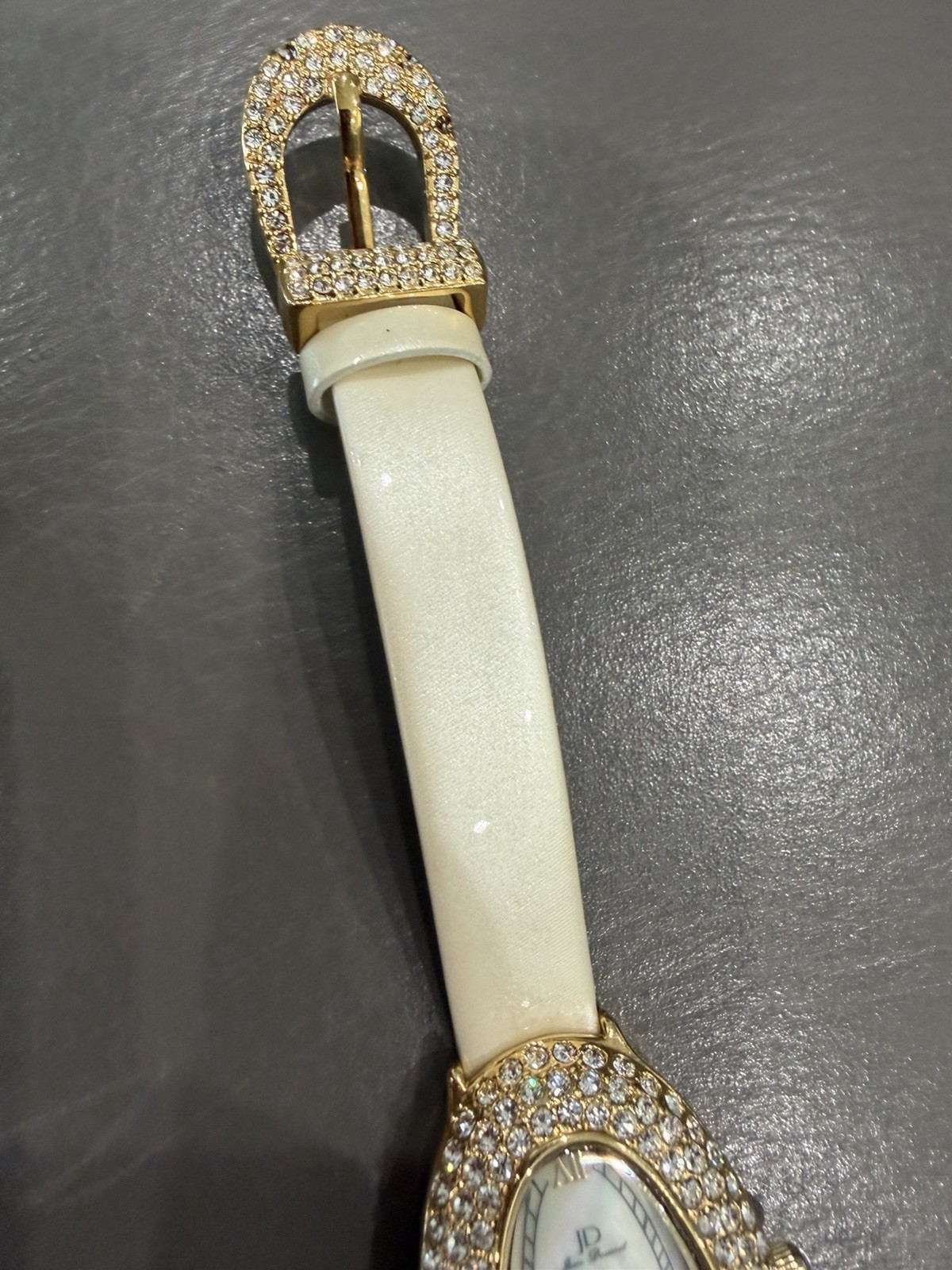 Vintage Jean Dousset Leather, Rhinestone Watch With Beige oval face.