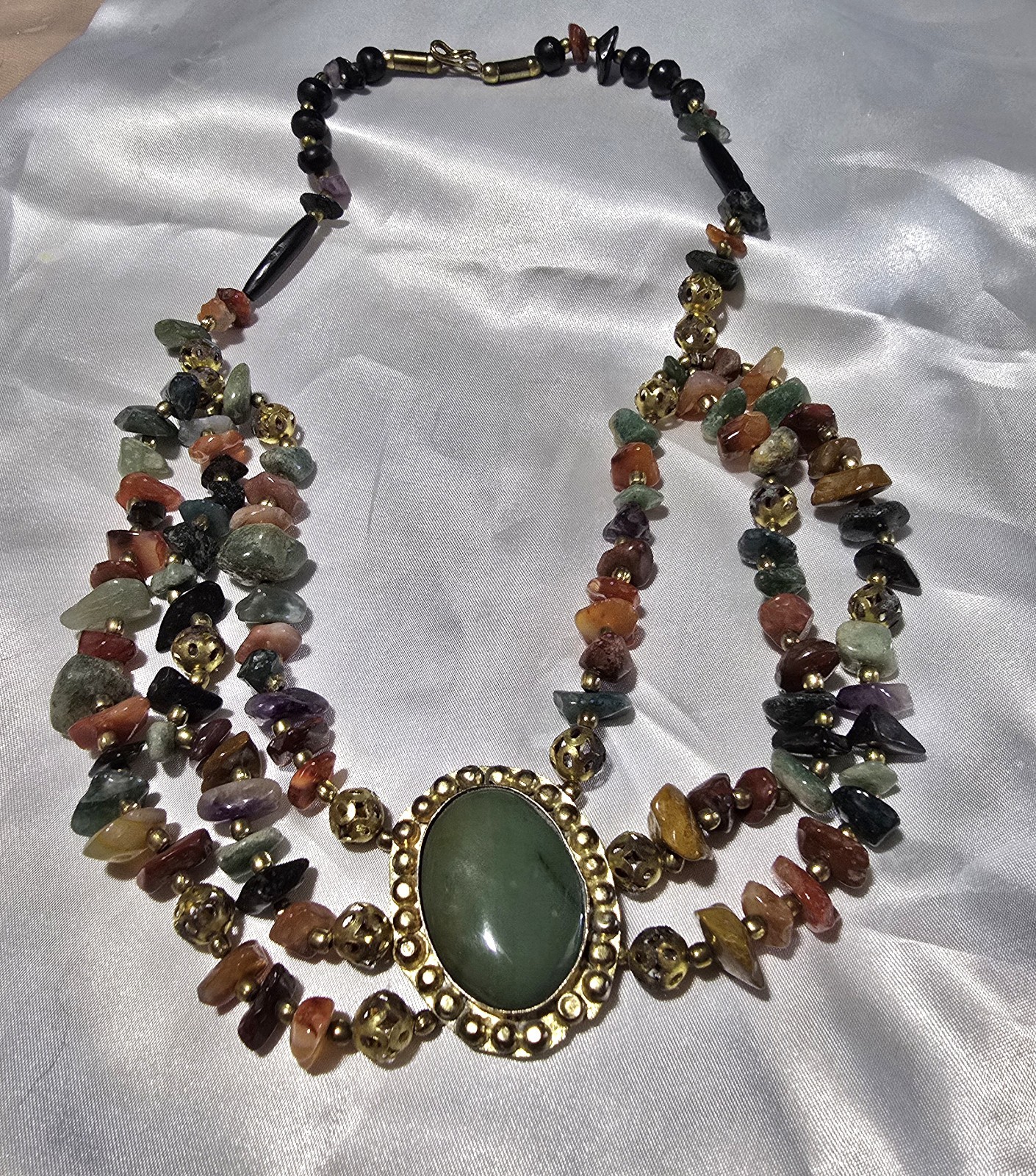 Vintage Multi-strand gemstone necklace with green aventurine centerpiece.