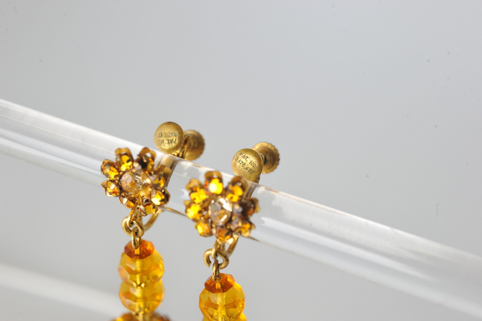 Vtg signed Miriam Haskell rhinestone Gold Tone drop clip earrings amber color