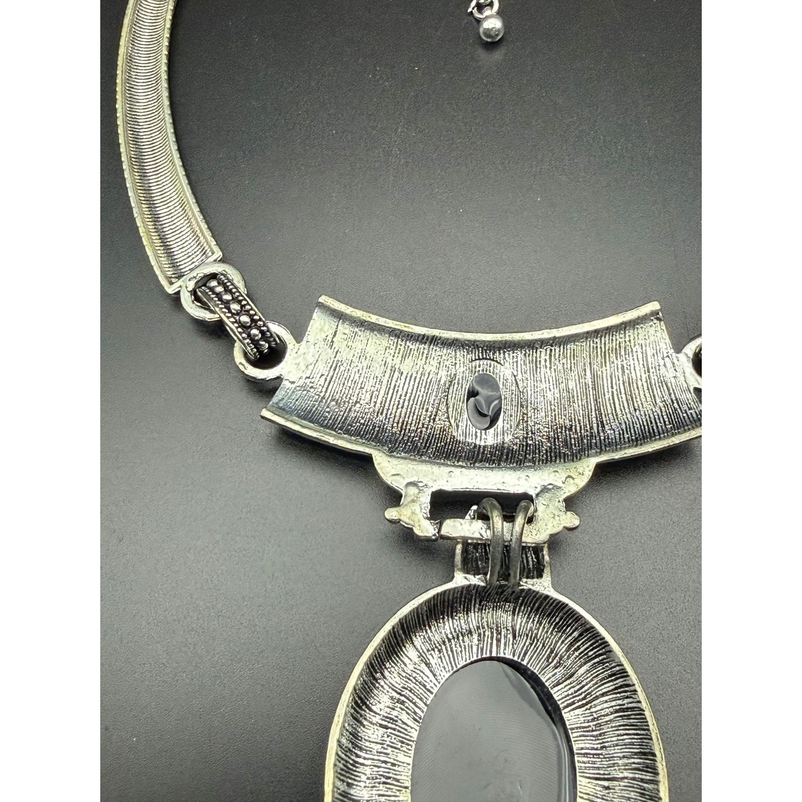 Vintage style silver-tone necklace with black enamel pendant