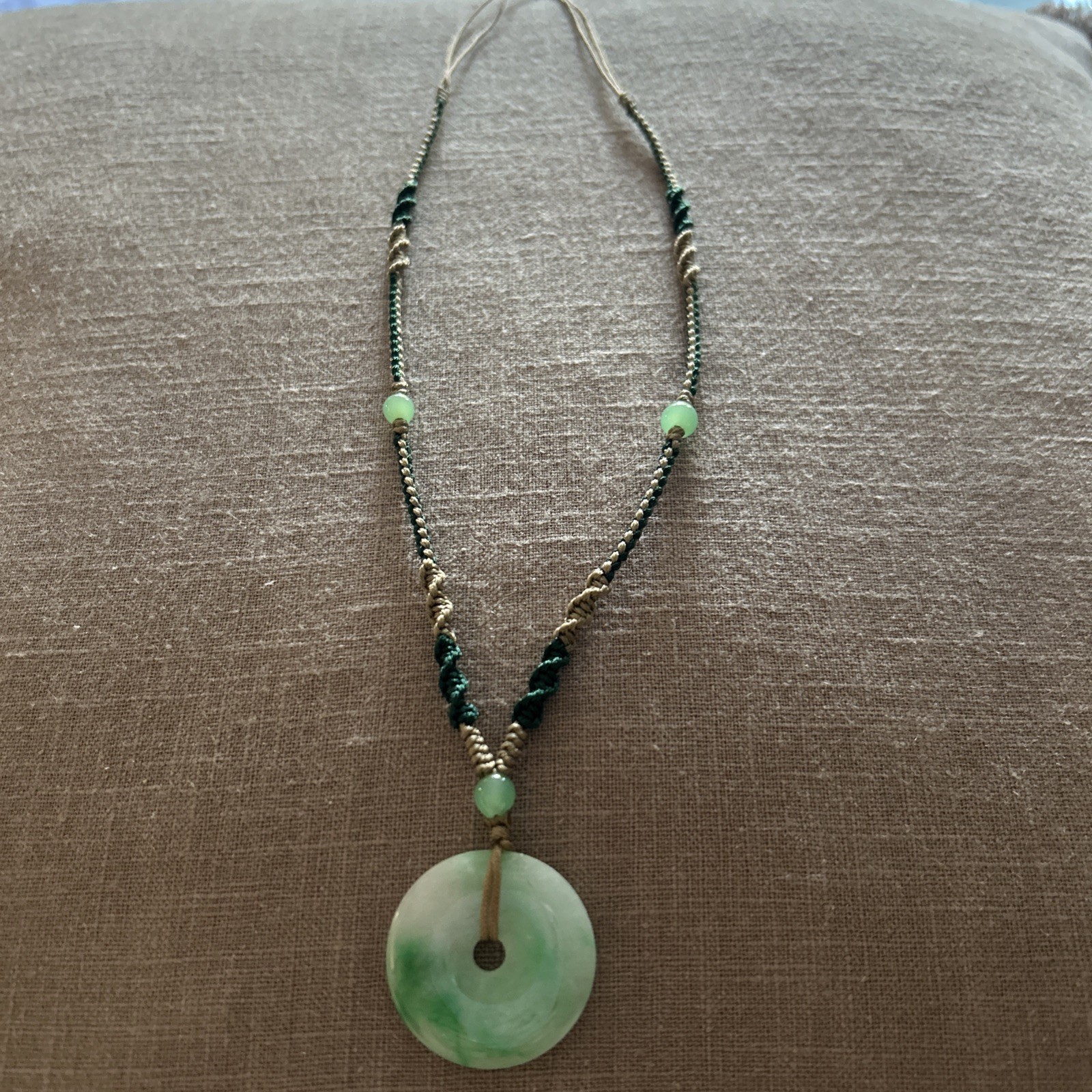 Vintage Green Jade Pendant 1-1/8” on a braided tan and green cord w/3 jade beads