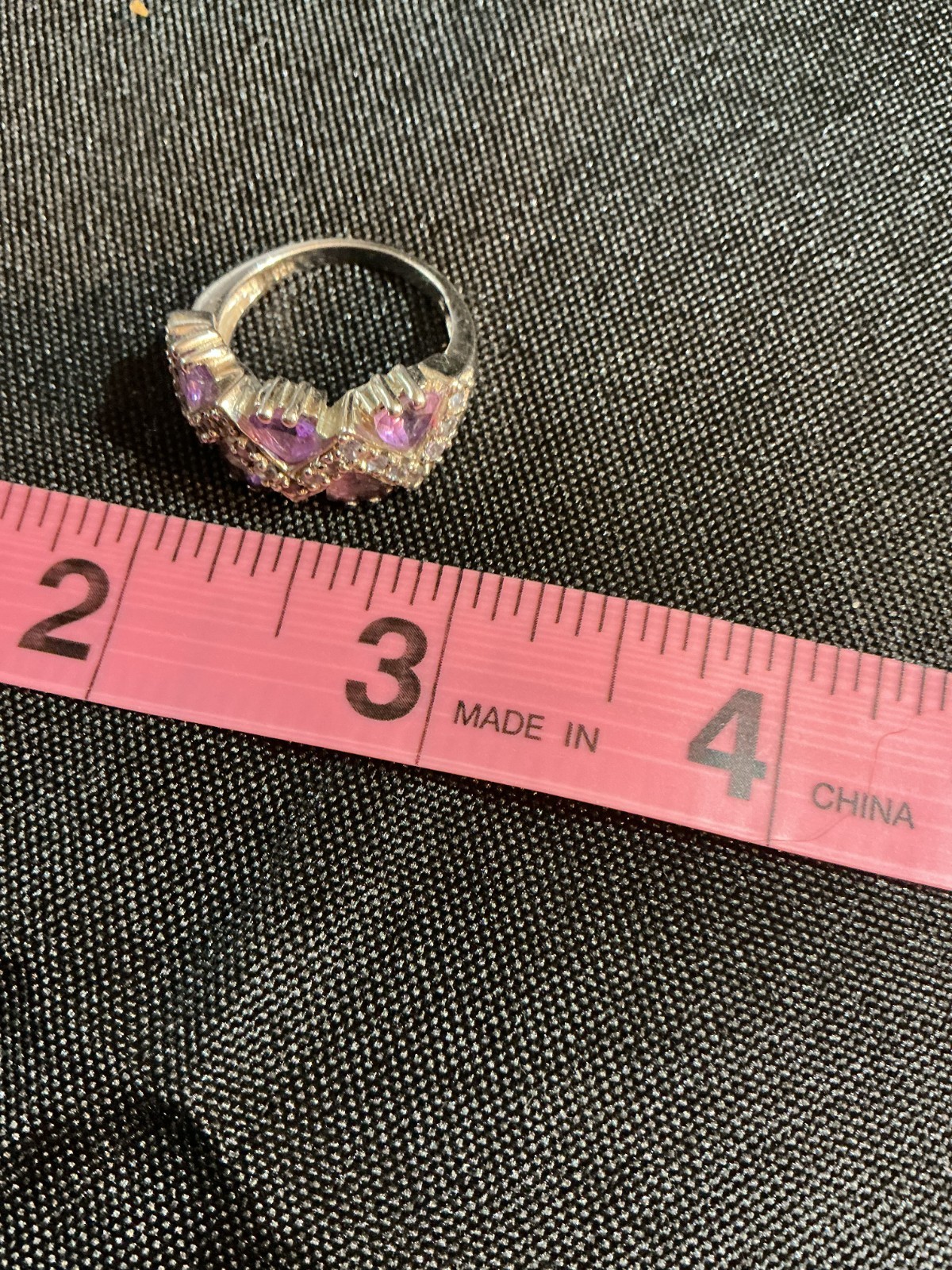 sterling silver ring features amethyst trillion-cut gemstones