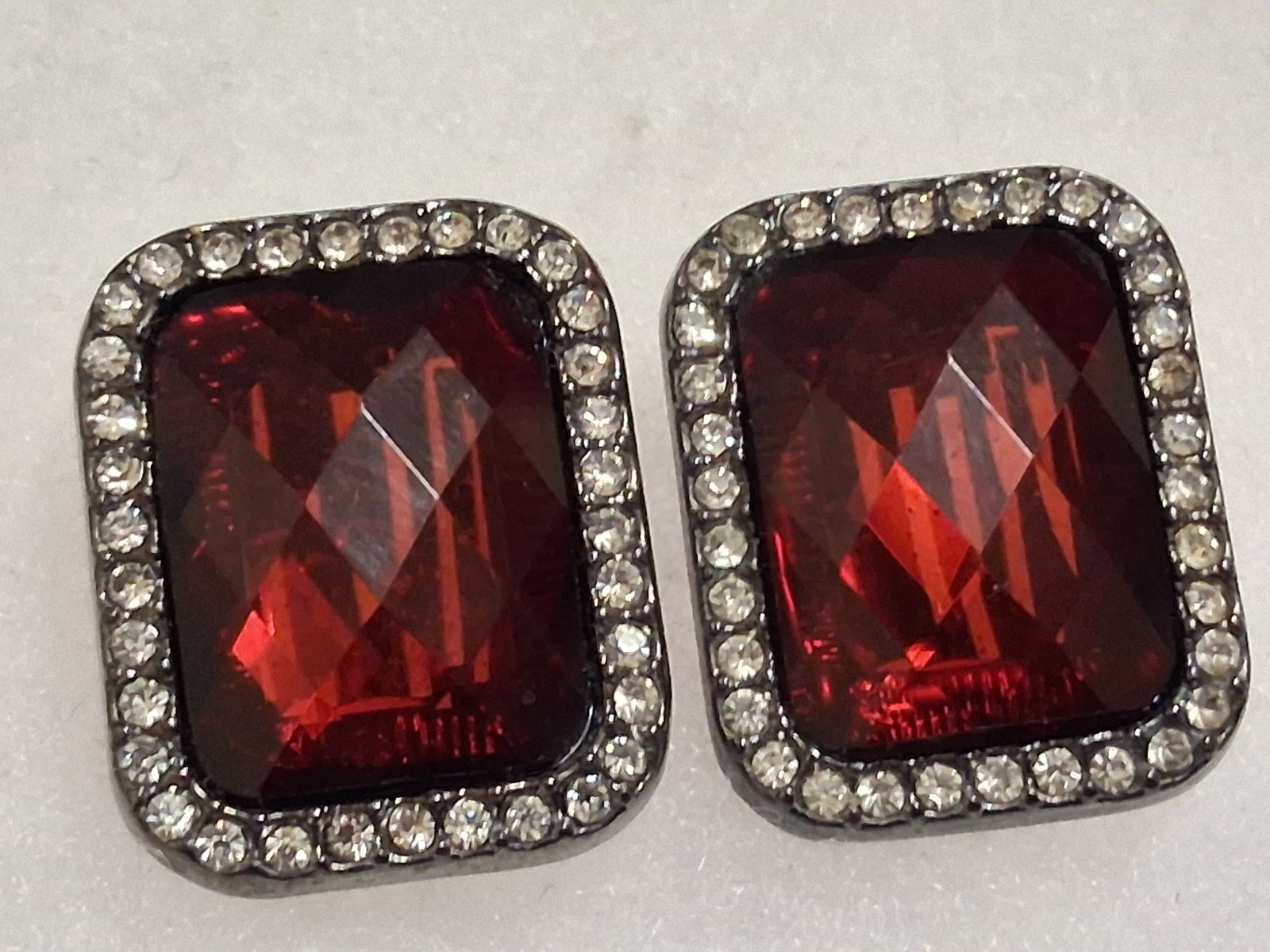 Red faceted acrylic rectangle clip on halo earrings, clear rhinestone border