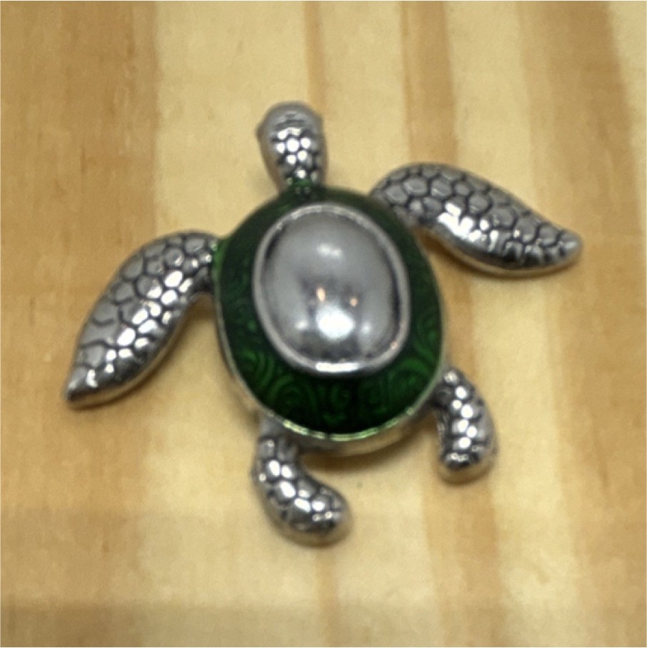 Metal turtle figurine with green and silver shell.(not jewelry)