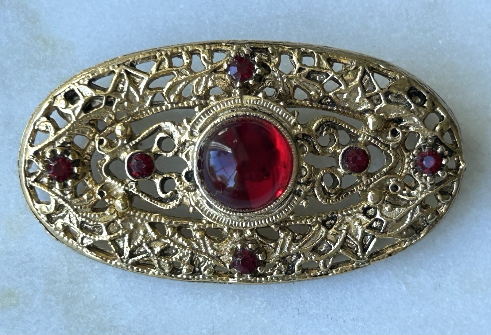 Vintage Victorian Revival Red Cabochon Rhinestone Gold Tone Filigree Brooch Pin