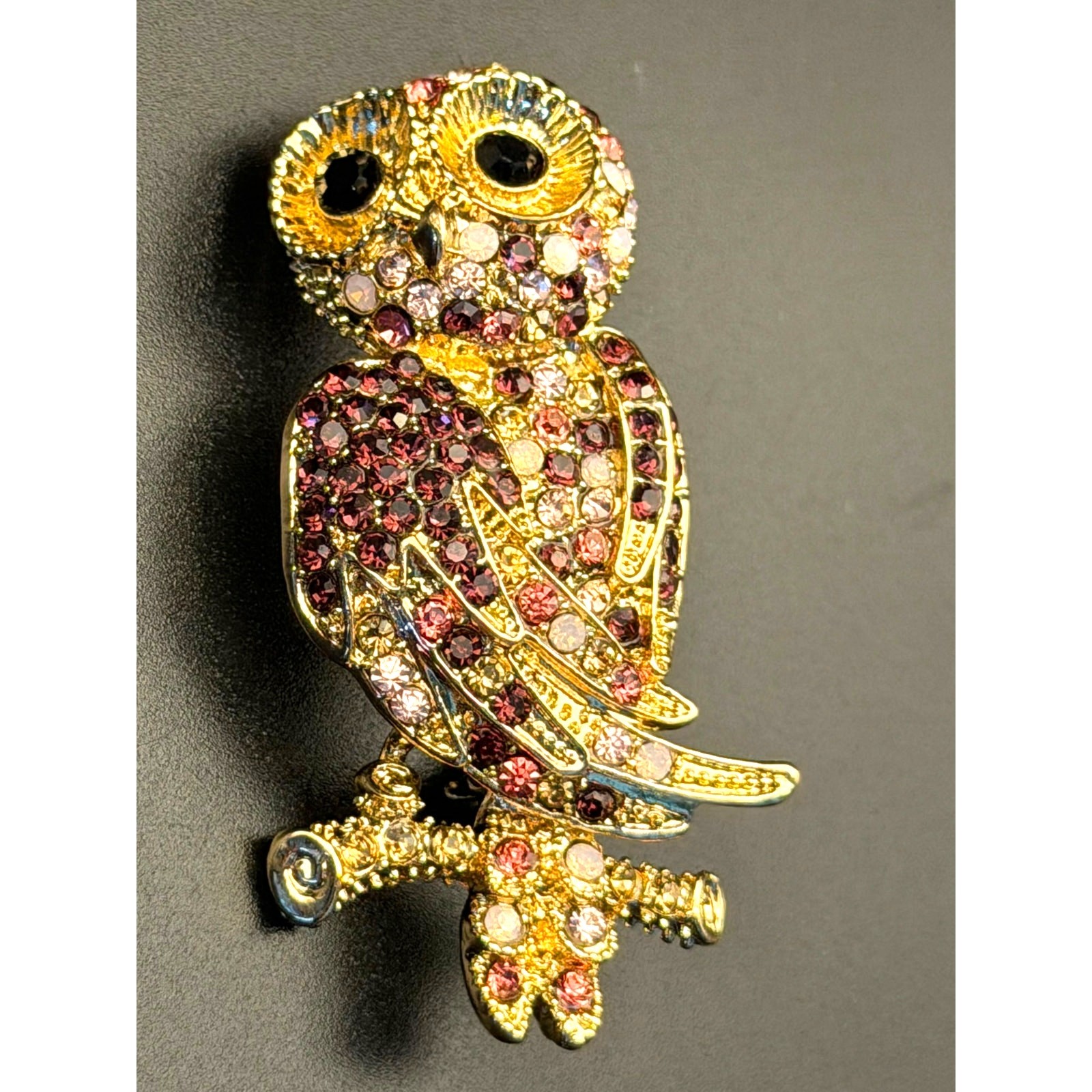 Vintage Monet gold-tone rhinestone owl brooch with purple, pink, white stones